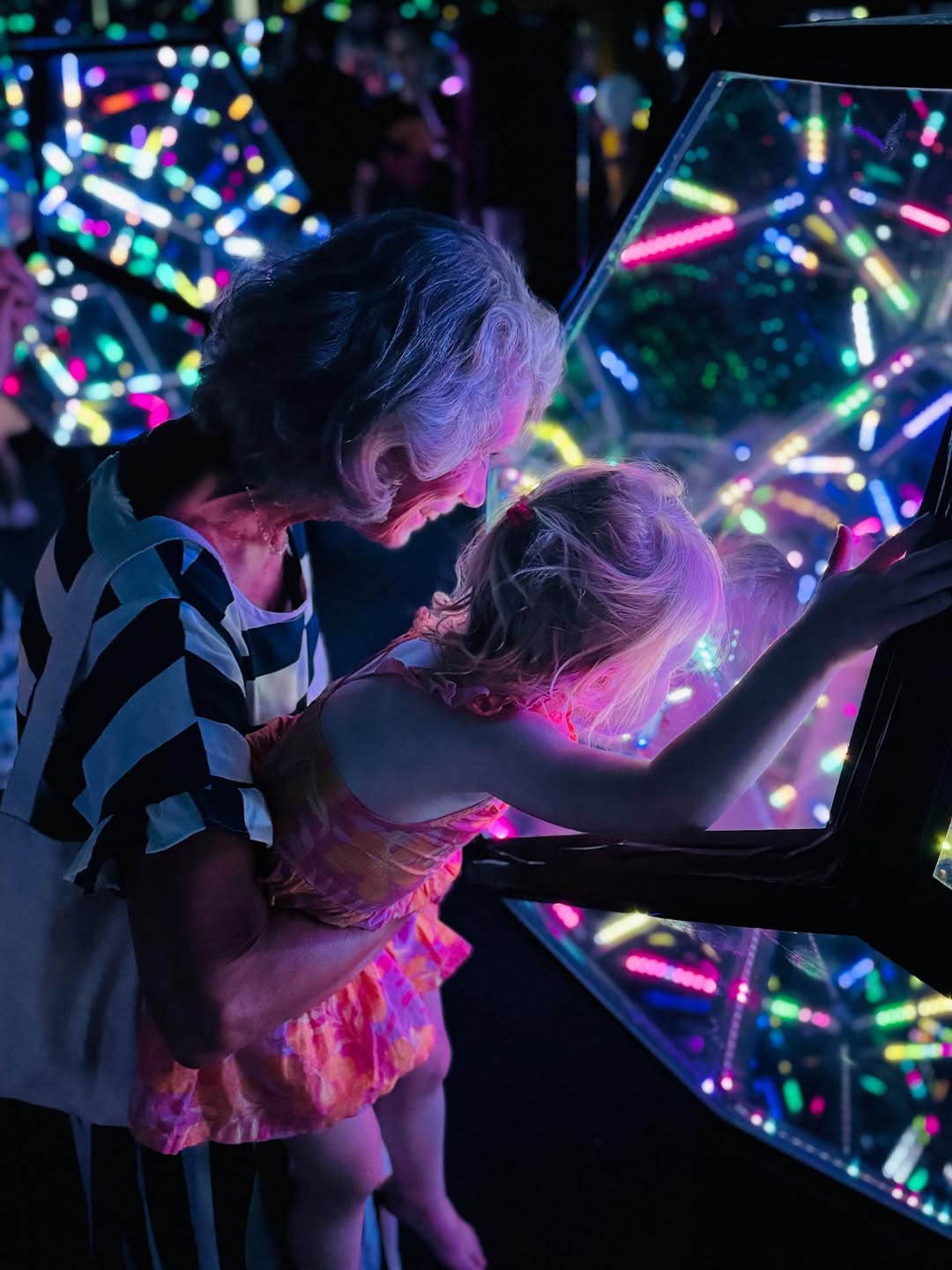 Woman and child looking into dodecahedron